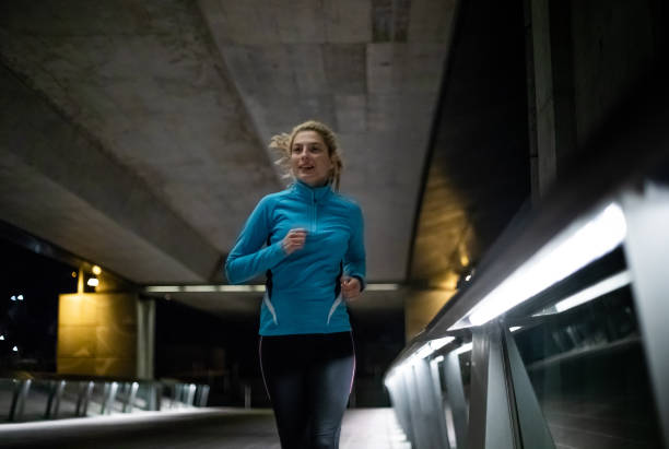 istock Female Athlete Running in an Urban Environment 1064127374
