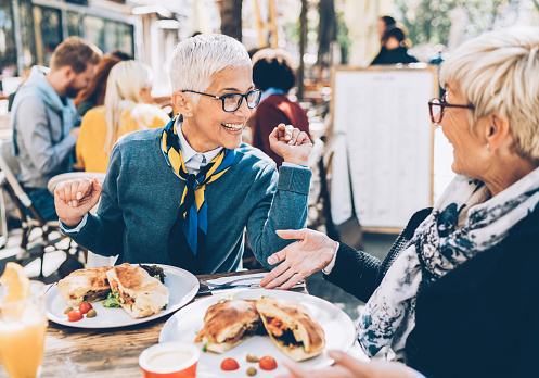 Two Mature women Having Lunch at Outdoor Restaurant