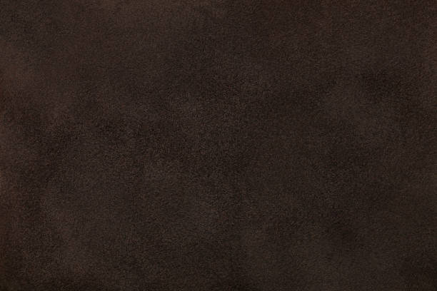 istock Dark brown matt suede fabric closeup. Velvet texture. 1064134888