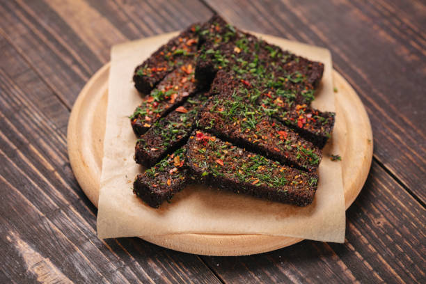 istock Grilled bread pieces served on baking paper as beer snack 1064137272