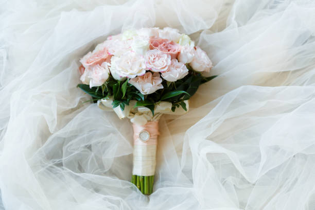 istock wedding golden rings with pastel pink rose 1064144958