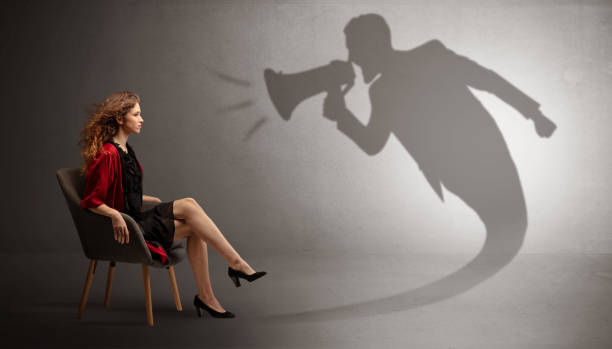 istock Dark shadow yelling to elegant lady 1064151592