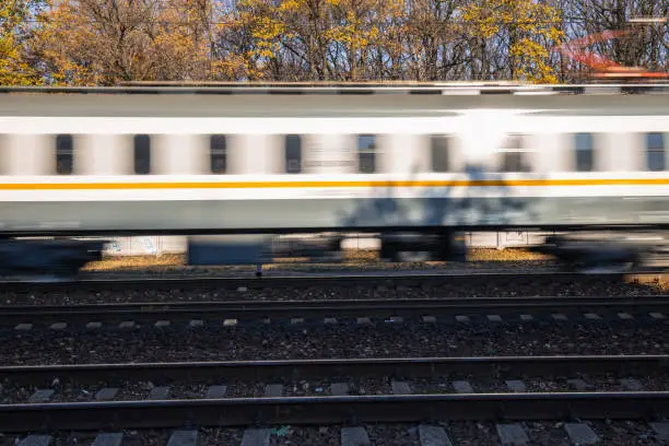 The train is gaining speed for movement by rail. Locomotive blurred.