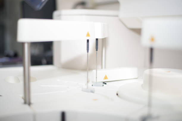 istock Blurred automate chemistry on white tone.Medical concept. 1064153446
