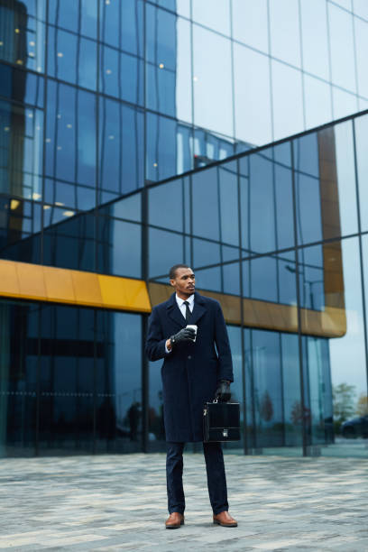 istock Businessman in coat 1064154970
