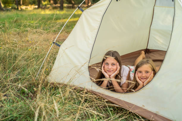 istock Two young girls in tent. 1064157766