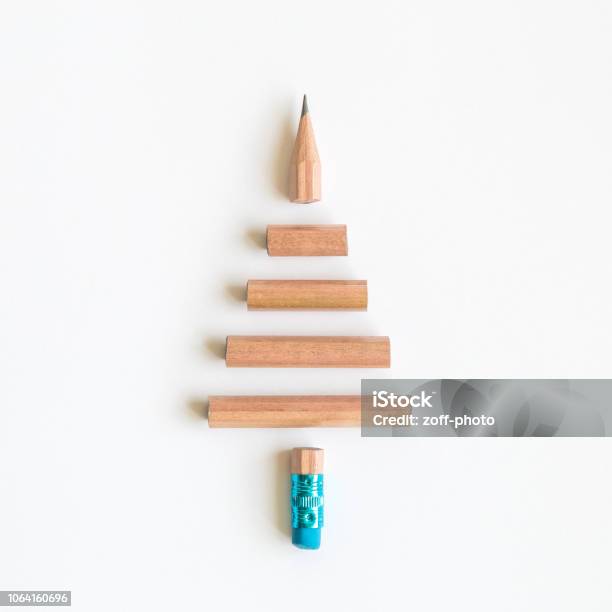 Flat Lay Of Pencil In Form Of Christmas Tree Abstract On Bright Background Stock Photo - Download Image Now