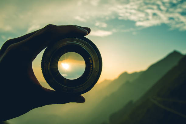 Camera lens at sunset stock photo