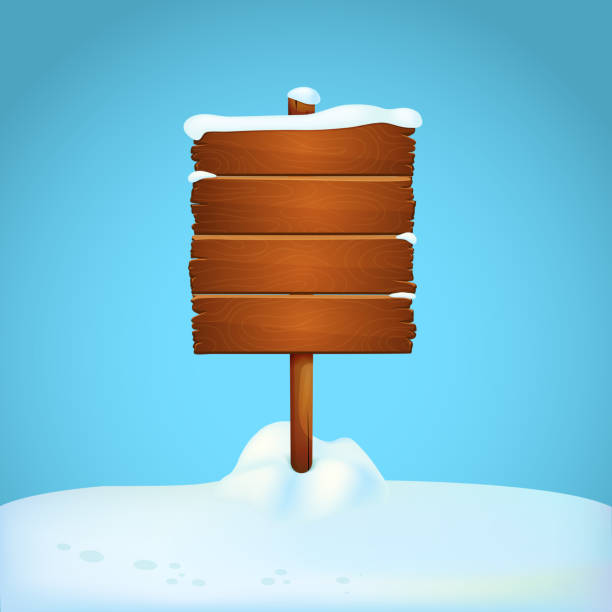istock Large wooden signpost on the snowy ground with blue background. 1064166490