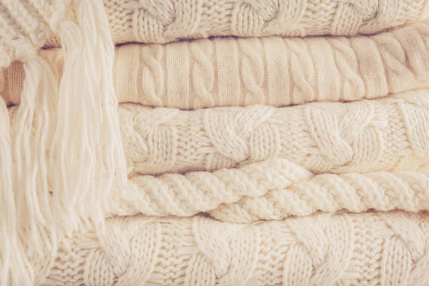 istock White knits pile. Warm cozy home concept 1064168718