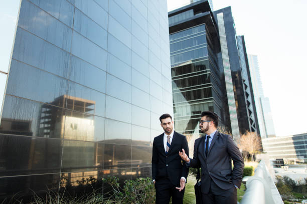 istock Hispanic business partners talking at lunch time 1064175284