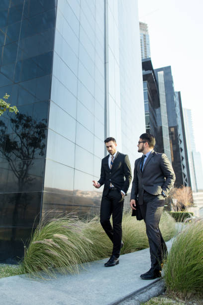 istock Young entrepreneurs walking and talking outside 1064175294