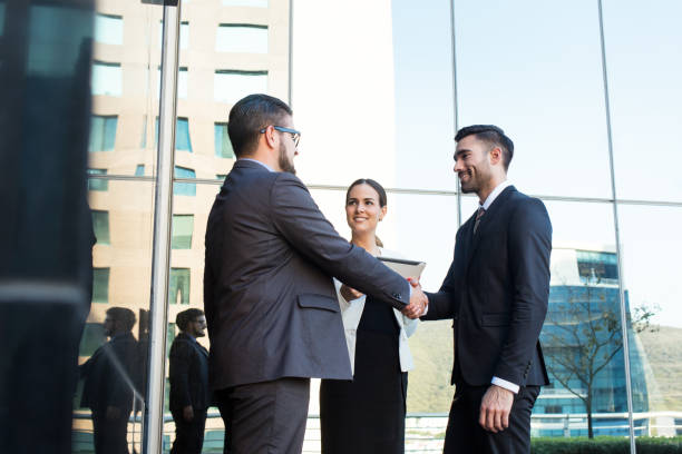 istock Hispanic business executives closing deal 1064175298
