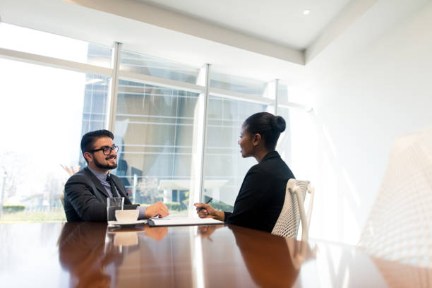 istock Young hispanic business partners in meeting 1064175462