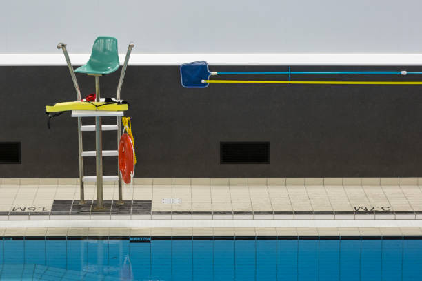 Public swimming pool with lifeguard chair