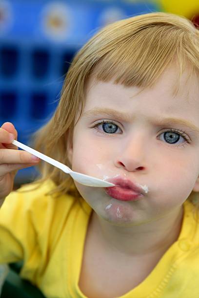 istock Blond little girl eating and gesturing 106418001