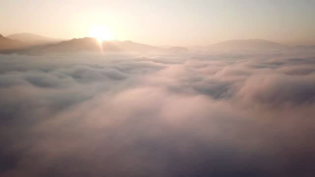 Aerial view above the clouds and sky in sunrise time , Inspiration concept