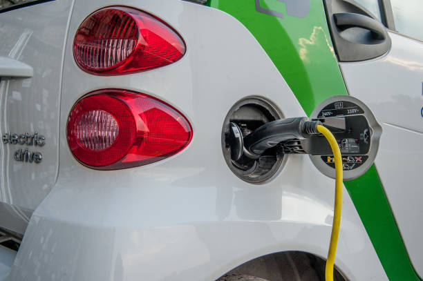 electric car Milan italy 11 June 2015: car that runs on electricity to the energy distributor for charging fuel and power generation greenhouse efficiency power supply stock pictures, royalty-free photos & images