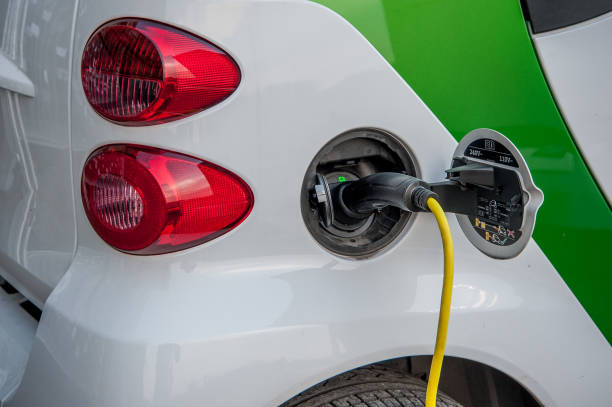 electric car Milan italy 11 June 2015: car that runs on electricity to the energy distributor for charging fuel and power generation greenhouse efficiency power supply stock pictures, royalty-free photos & images