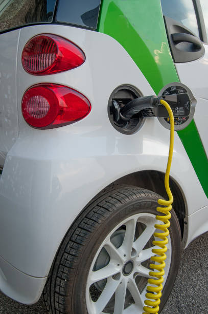 electric car Milan italy 11 June 2015: car that runs on electricity to the energy distributor for charging fuel and power generation greenhouse efficiency power supply stock pictures, royalty-free photos & images