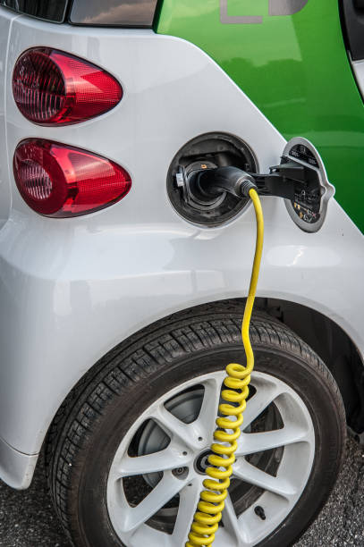 electric car Milan italy 11 June 2015: car that runs on electricity to the energy distributor for charging fuel and power generation greenhouse efficiency power supply stock pictures, royalty-free photos & images