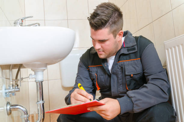 istock Young Plumber With Clip Board 1064188860