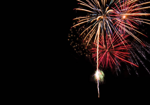 istock Big red gold and blue fireworks background with copy space for new year celebration or special holiday event 1064189862