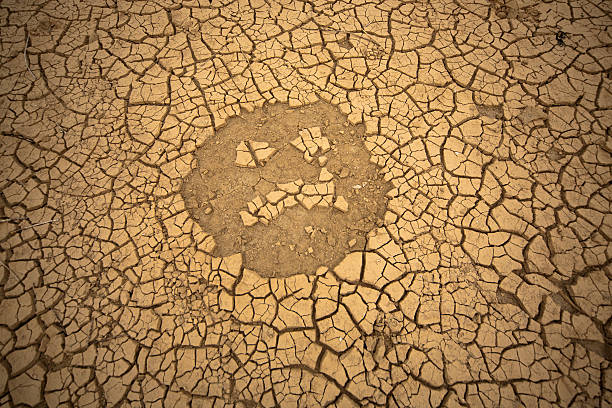 sad smiley of drought stock photo