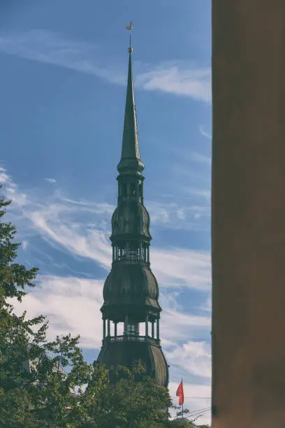 Photo of Spire with a rooster of St. Peter's Cathedral in Riga