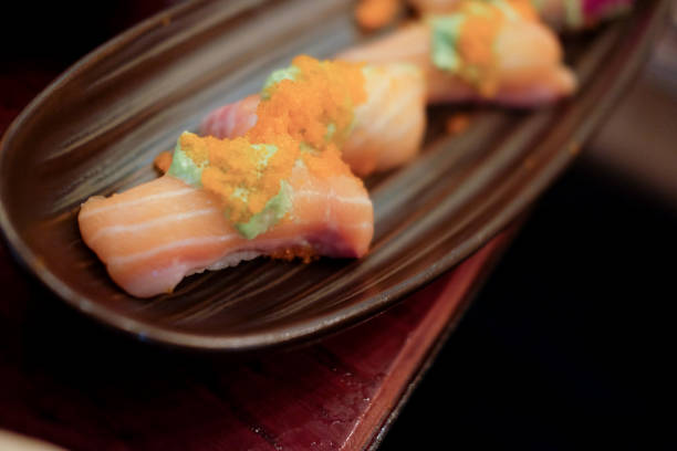 istock Sushi roll with salmon. Selective focus. Close up of sashimi sushi set 1064198852