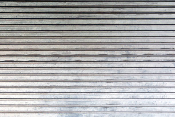 istock Corrugated metal sheet door., background and texture 1064202356