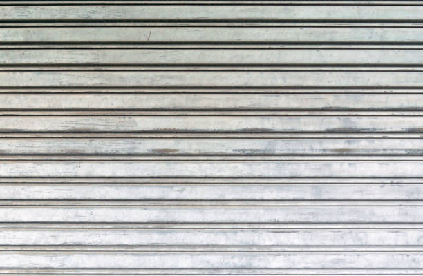 istock Corrugated metal sheet door., background and texture 1064202362
