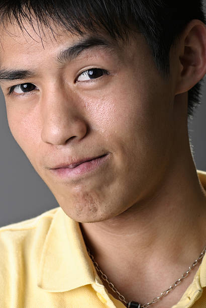 atraente rosto de jovem do sexo masculino - east asian ethnicity japanese ethnicity asian ethnicity one person imagens e fotografias de stock