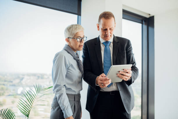 istock Coworkers looking at digital tablet 1064205176