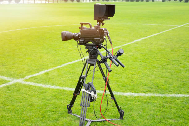 istock TV camera at the stadium, broadcasting during a football (soccer) match 1064205986