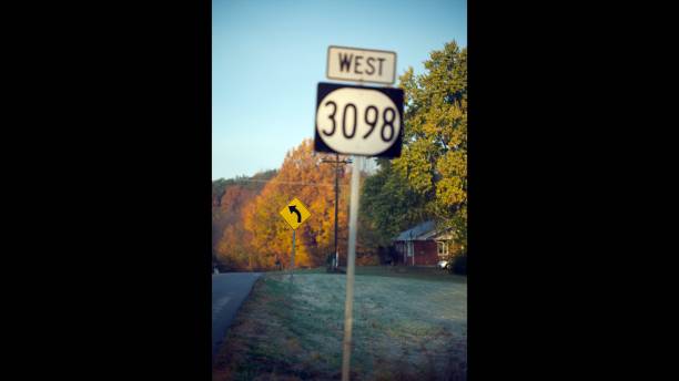 istock Road Curves to Left Street Sign 1064207530