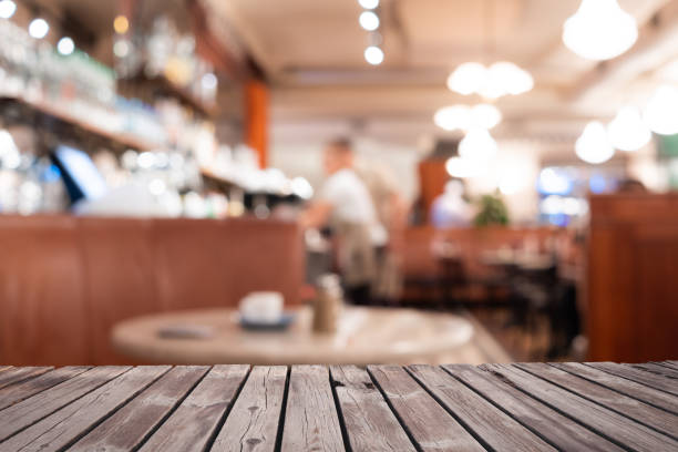 istock Perspective wood and blurred cafe with bokeh light background. 1064214840