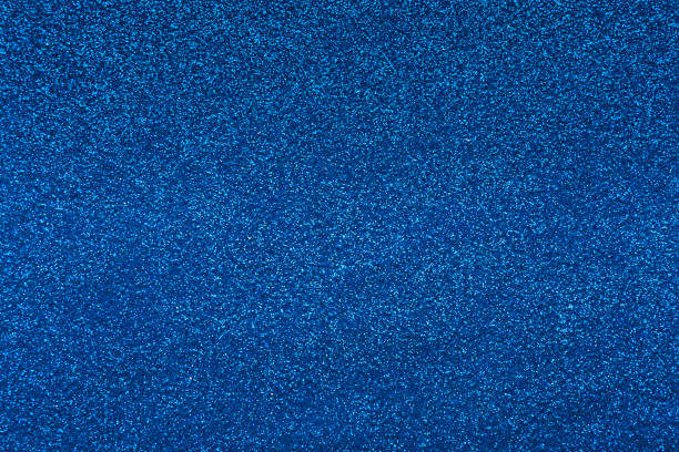 istock Christmas gifts wrapping blue glitter textured paper 1064221528