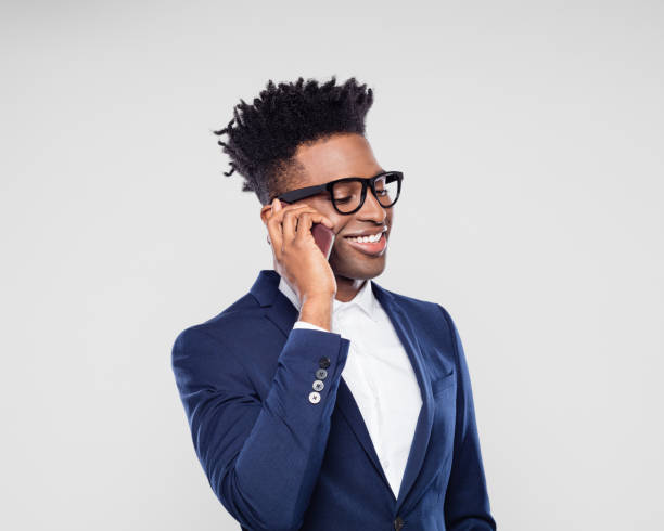 istock Smiling businessman making a phone call 1064221660