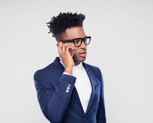 istock Handsome black businessman talking on mobile 1064224738