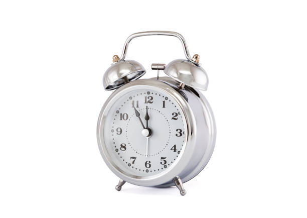 istock Old style alarm clock with clipping path on white background 1064225552
