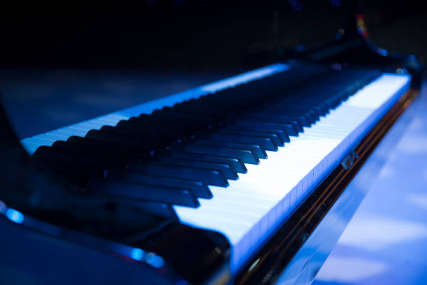 istock the piano on stage in the spotlight. 1064225900