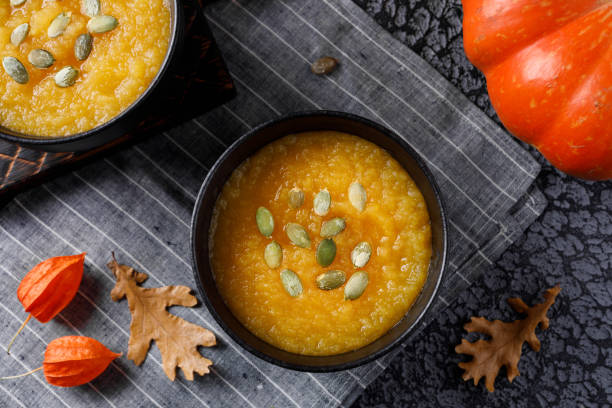 istock Autumn still life with pumpkin cream soup and vegetables. 1064226268