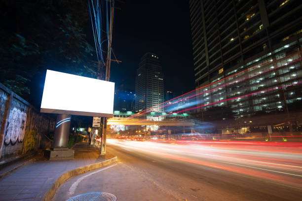 istock Blank billboard for advertisement at night time with street light 1064232278