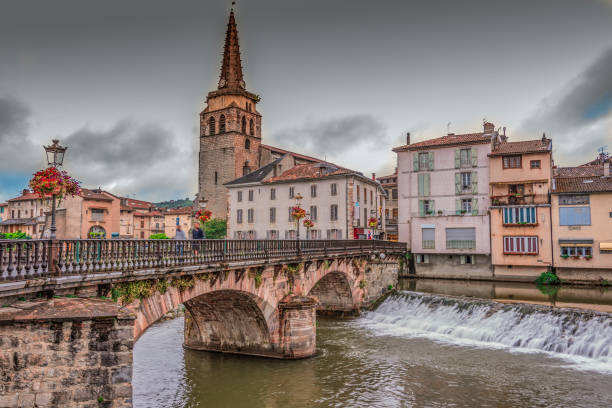 Bridge and church in the village of Saint Girons. France stock photo
