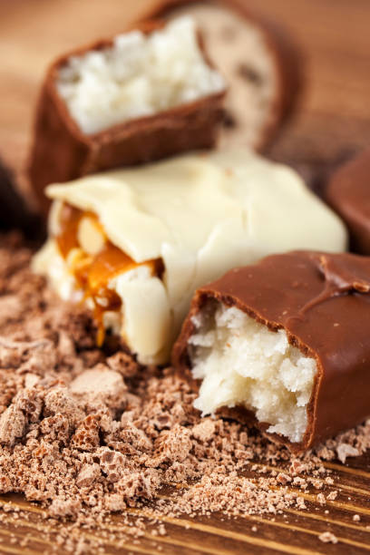 istock Various yummy chocolate candies on wooden table, sweets 1064238630