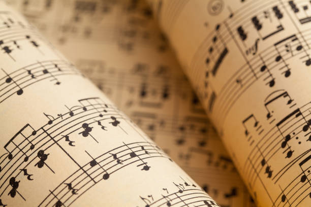 Music Rolls Several Music Sheets in a Rolled Pile. choir photos stock pictures, royalty-free photos & images
