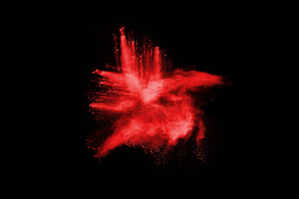 istock abstract red powder explosion on black background.abstract red powder splatted on black background. Freeze motion of red powder exploding. 1064244438
