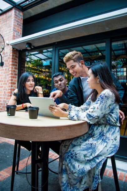 istock Casual chat by a group of friends 1064246120