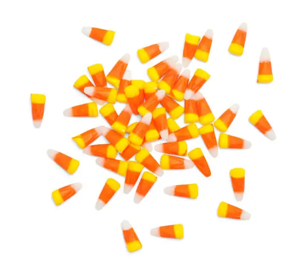 Scattered Pile of Candy Corn Isolated on White.